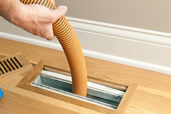 Vacuum Hose Cleaning Floor Vent and Duct
